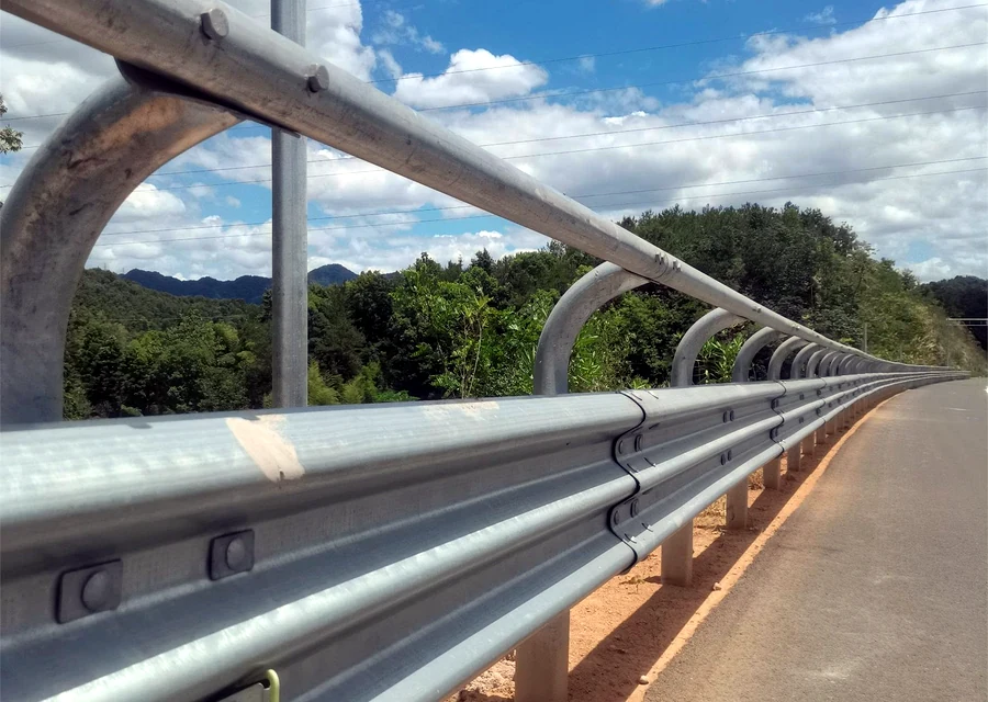 Galvanized highway guardrail installed along a road for RFQ checklist review