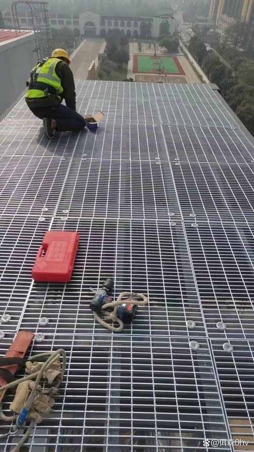 Worker inspecting industrial platform grating floor for plant maintenance access