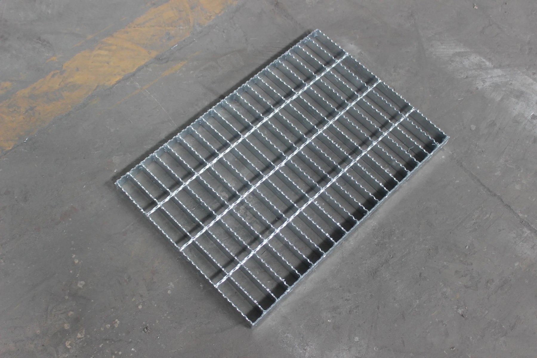 Serrated steel grating close-up surface