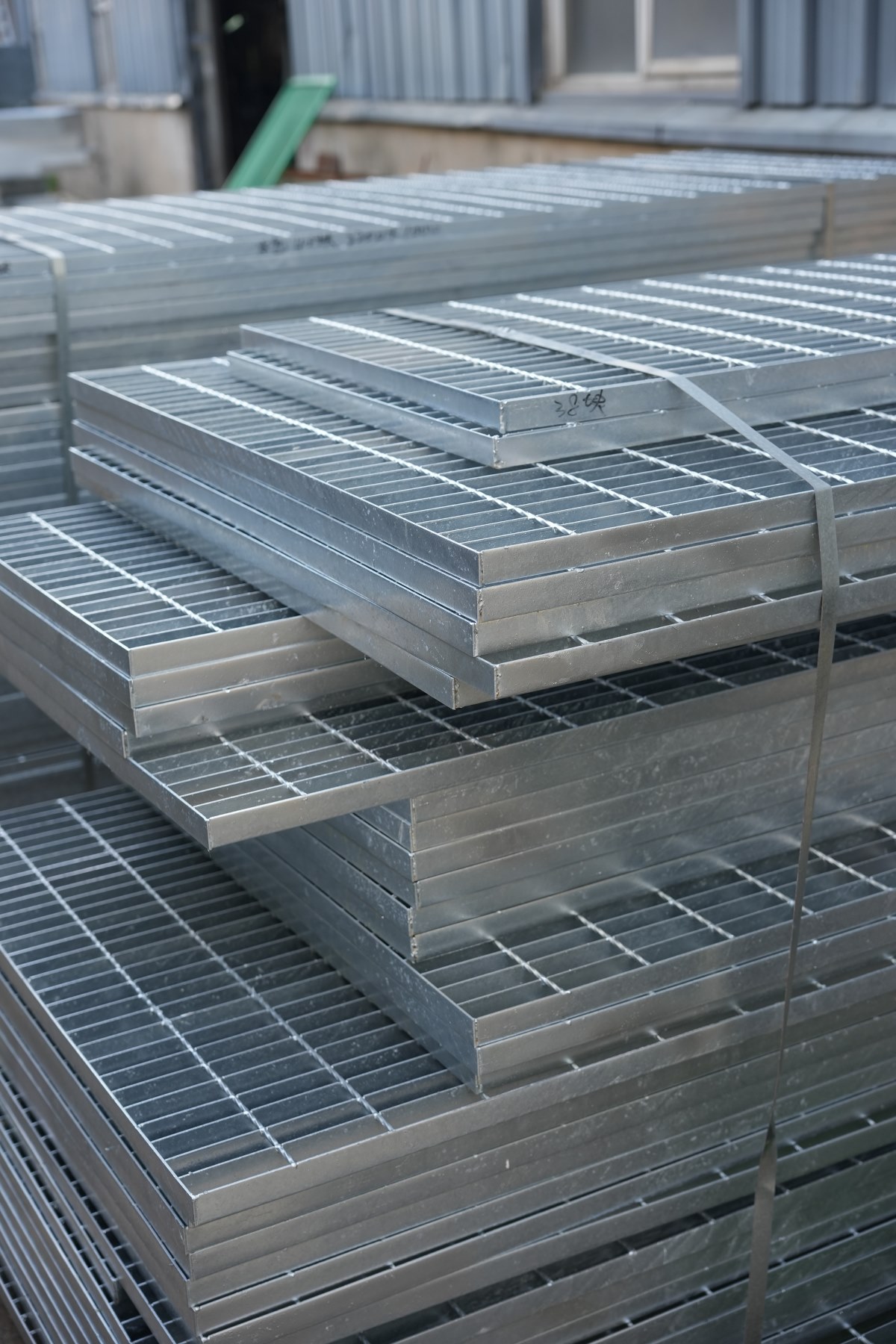 Galvanized steel grating panels stacked and packed for export shipment