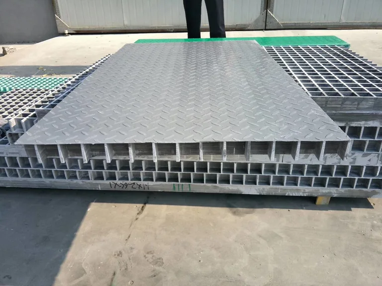 Grey FRP trench cover replacement panels with reinforced underside grid
