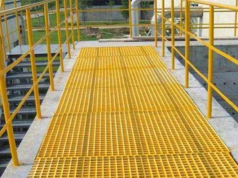 Yellow molded FRP grating installed for wet access walkway